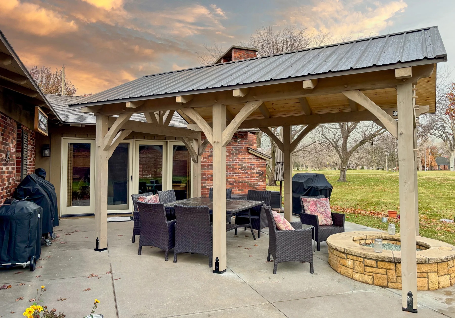 pavilion with outdoor table and fire pit